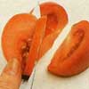 Крылышки из помидоров Продольно разрежьте помидор пополам и положите срезанной стороной на разделоч... - 2
