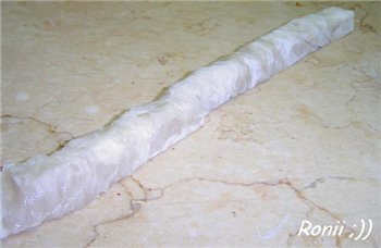 Затем смазать форму самне или сливочным маслом и уложить свернутые порции КУЛЛЯДЖ
